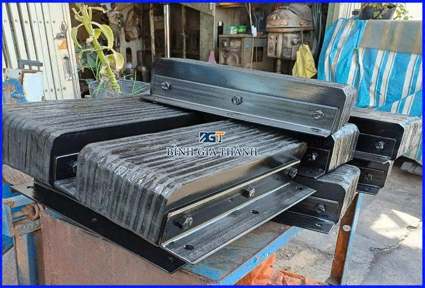 CAO SU GIẢM CHẤN DẠNG ÉP/DÁN LỚP